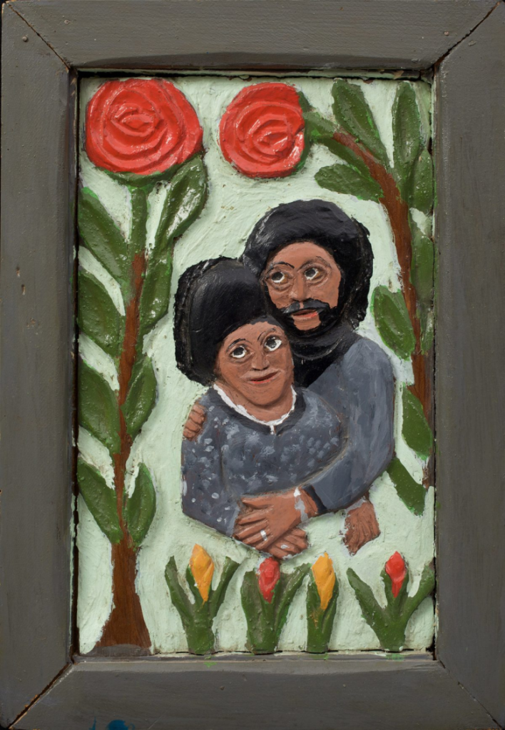 Elijah Pierce (American, 1892–1984), :Couple with Roses” (1975), paint on carved wood 14 1/2 × 10 1/4 inches (Collection of Jill and Sheldon Bonovitz. Promised gift to the Philadelphia Museum of Art)