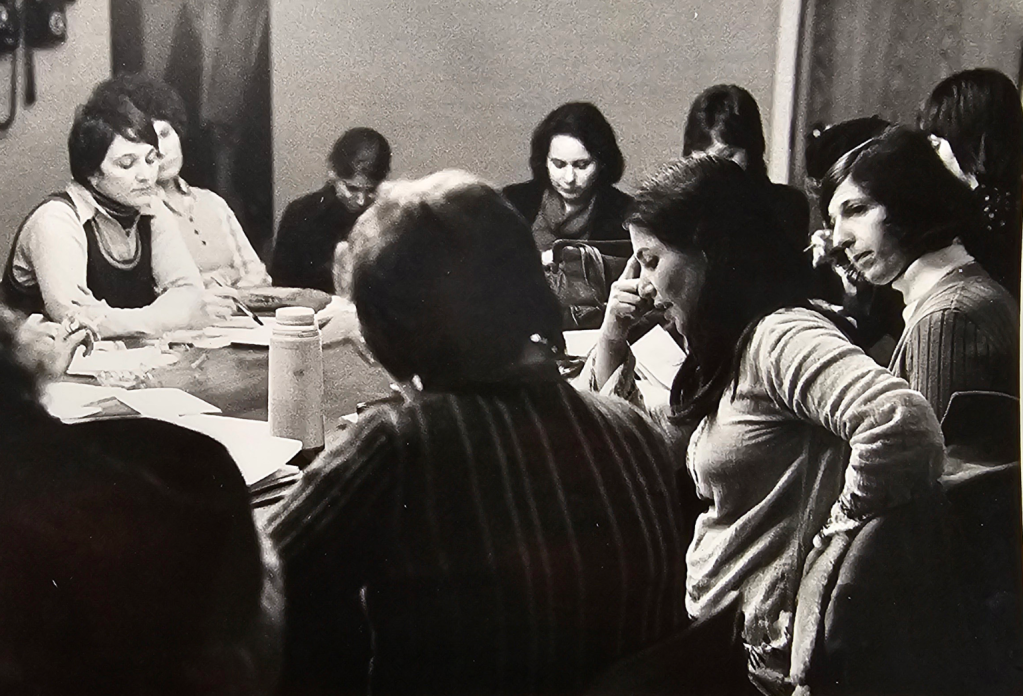 The steering committee for the 1974 Philadelphia Focuses on Women in the Visual Arts in a meeting at Moore College of Art & Design. Left to right: Arleen Olshan, Diane Burko, Judith K. Brodsky. Photograph retrieved from a contact sheet of events during Philadelphia Focuses on Women in the Visual Arts, 1974. The contact sheet is located in the FOCUS records, Philadelphia Museum of Art, Library and Archives. Photographer unknown.